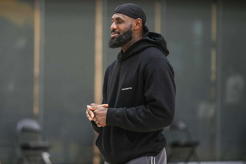 Los Angeles Lakers' LeBron James attends a news conference held to introduce the team's draft picks, his son, Bronny James and Dalton Knecht, in El Segundo, Calif., Tuesday, July 2, 2024. (AP Photo/Damian Dovarganes)