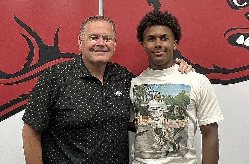 Arkansas coach Sam Pittman and 2026 QB Michael Mitchell Jr. during a June visit.