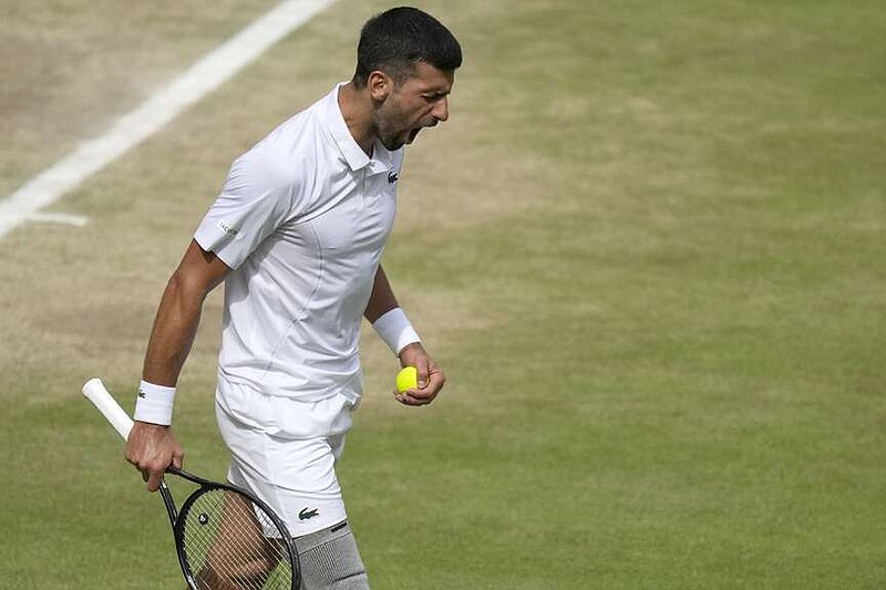 Novak Djokovic of Serbia reacts after losing a point against Carlos Alcaraz of Spain during the men's singles finalat the Wimbledon tennis championships in London, Sunday, July 14, 2024. (AP Photo/Mosa'ab Elshamy)