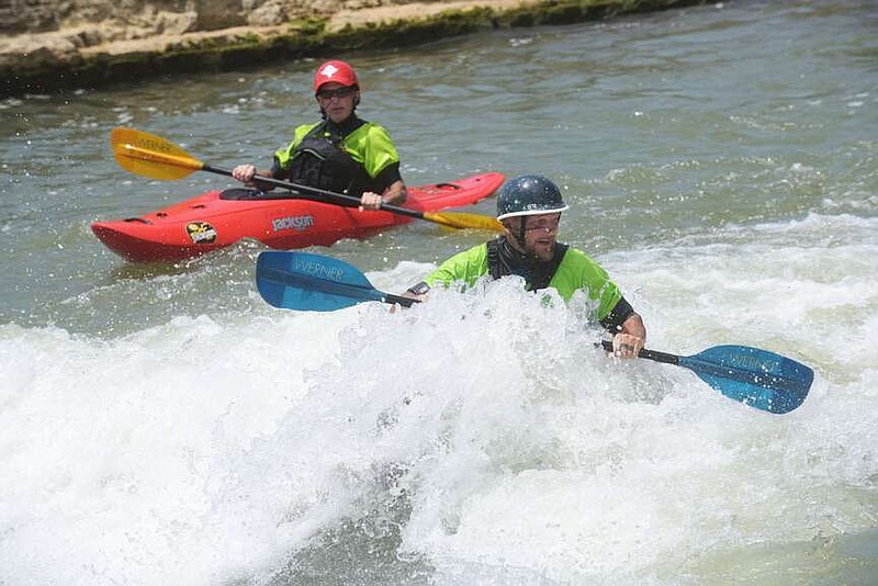 Randy Jackson (left) of Bentonville and Lucas Wicker of Rogers hone their kayak skills on June 21 2024 at WOKA Whitewater Park on the Illinois River. The park is a few miles south of West Siloam Springs, Okla.
(NWA Democrat-Gazette/Flip Putthoff)