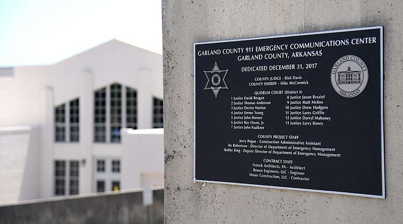 The dedication plaque for the Garland County 911 Emergency Communications Center is shown. (The Sentinel-Record/Donald Cross)