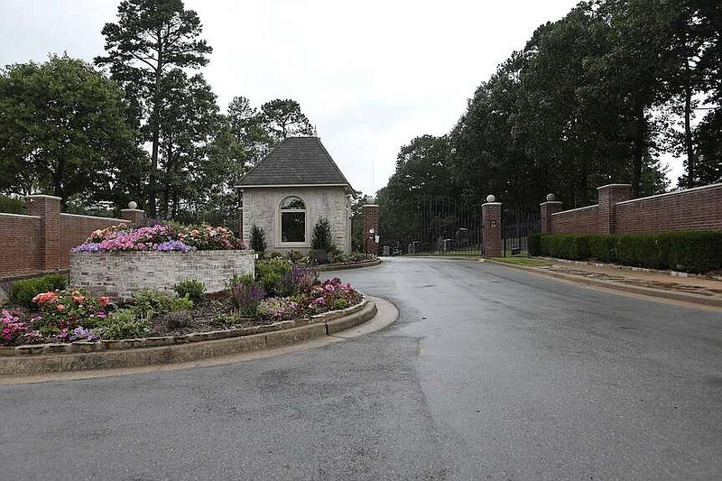 $2.5 million. 7 Spring Valley Lane. Owned by CBM Appraisals Inc., a house behind this gate was sold to Elizabeth and Peter Gleason. (Arkansas Democrat-Gazette/Thomas Metthe)