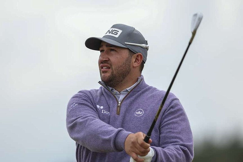 Thriston Lawrence of South Africa watches his shot on the 12th hole during his final round of the British Open Golf Championships at Royal Troon golf club in Troon, Scotland, Sunday, July 21, 2024. (AP Photo/Peter Morrison)