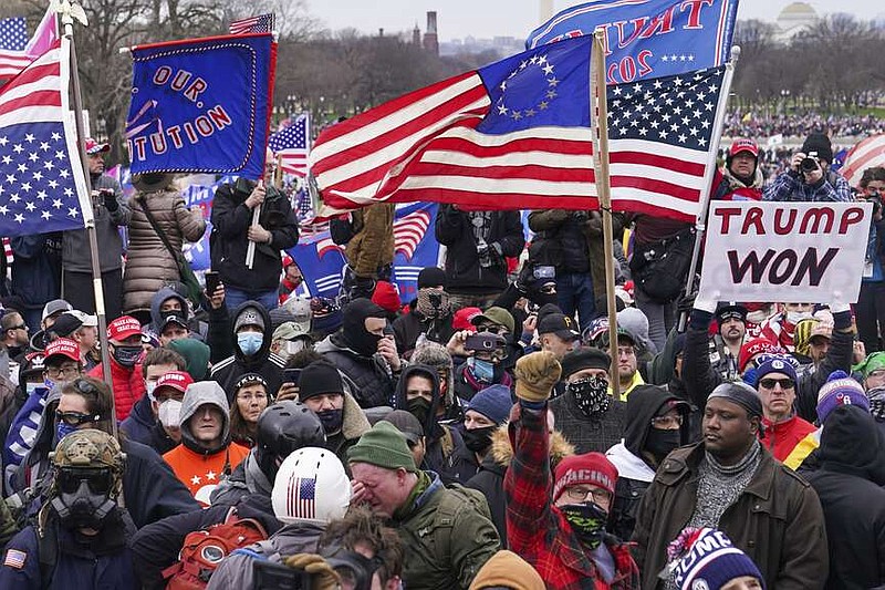 FILE - Rioters are seen at the U.S. Capitol on Jan. 6, 2021, in Washington. (AP Photo/John Minchillo, File)