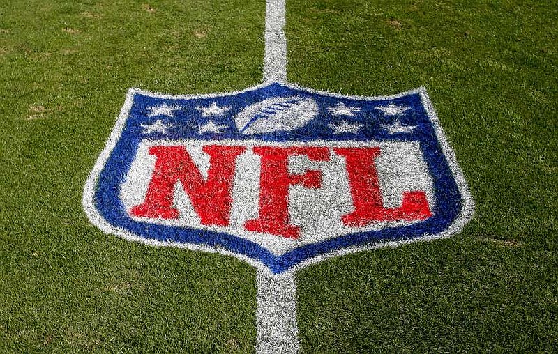 FILE - The NFL logo is displayed on the field at the Bank of American Stadium, Nov. 4, 2018, in Charlotte, N.C. The judge who presided in the class-action lawsuit filed by “Sunday Ticket” subscribers against the NFL said the jury did not follow his instructions in determining damages. (AP Photo/Nell Redmond, File)