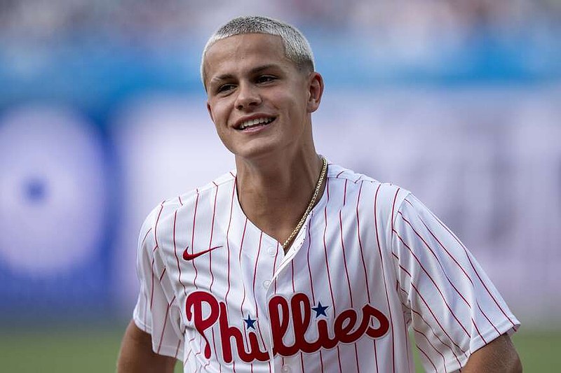 Philadelphia Union's Cavan Sullivan looks on after throwing of the ceremonial first pitch before the first inning of a baseball game between the New York Yankees and the Philadelphia Phillies, Tuesday, July 30, 2024, in Philadelphia.  (AP Photo/Chris Szagola)