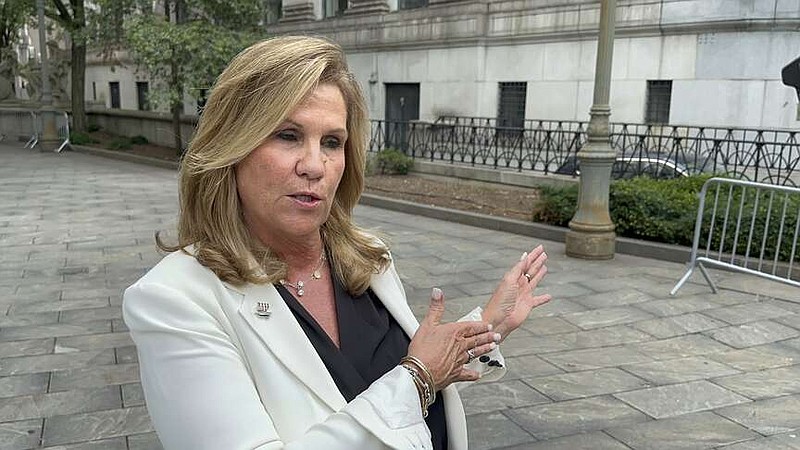 Terry Strada, national chair of 9/11 Families United, speaks outside Manhattan federal court on Wednesday, July 31, 2024, shortly after plea deals were announced for three men charged in the Sept. 11 attacks.  (AP Photo/Lawrence Neumeister)