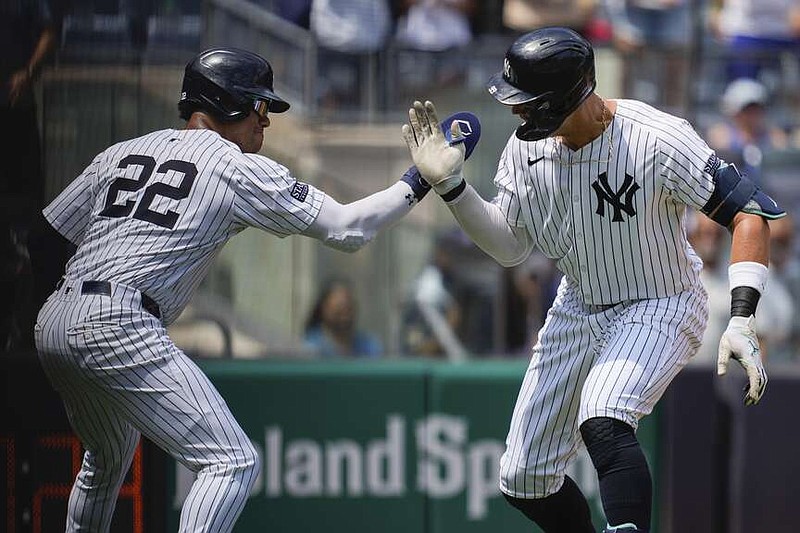 New York Yankees' Juan Soto (22) and Aaron Judge celebrate after Judge hit a two-run home run during the first inning of a baseball game against the Toronto Blue Jays, Saturday, Aug. 3, 2024, in New York. (AP Photo/Julia Nikhinson)