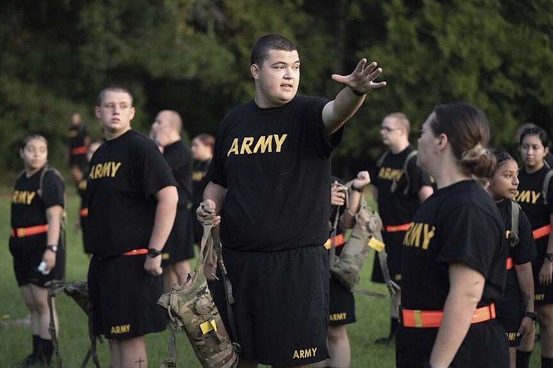 FILE - Students gather during physical training exercises in the new Army prep course at Fort Jackson in Columbia, S.C. Saturday, Aug. 27, 2022. The Army will expand its basic combat training for newly enlisted soldiers in what its leaders hope reflects a turning point as it prepares to meet the challenges of future wars. The added training will begin in October 2024 and comes as the Army works to reverse several years of dismal recruiting when it failed to meet its enlistment goals. (AP Photo/Sean Rayford, File)