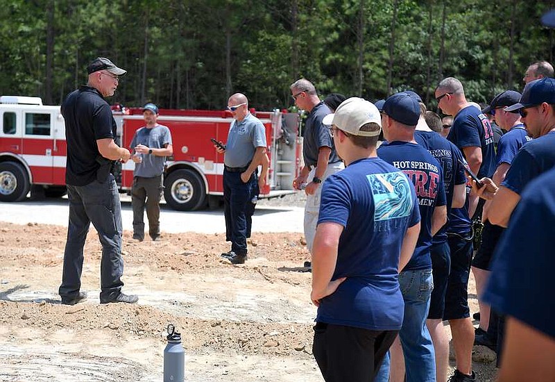 TJ Coleman, with the FBI, instructs students at the Garland County Landfill Friday afternoon. Coleman was one of the instructors for a single-day training course for firefighters about improvised explosives. (The Sentinel-Record/Donald Cross)