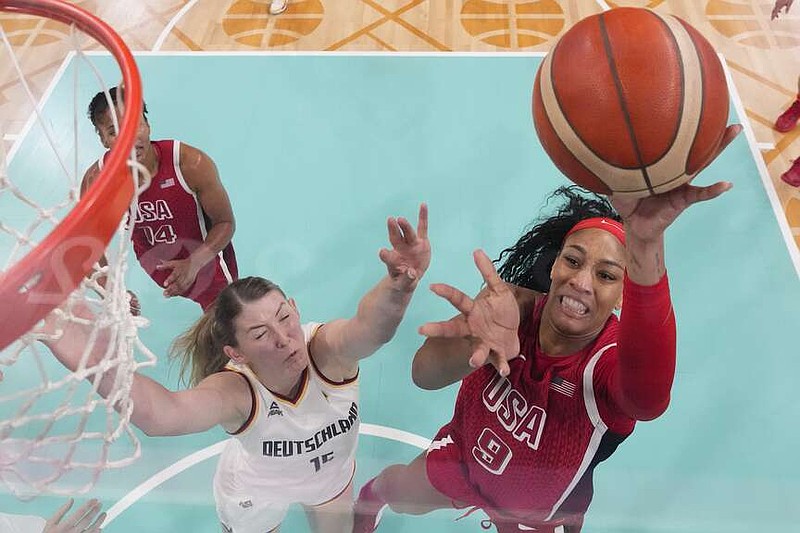 A'ja Wilson (9), of the United States, shoots over Luisa Geiselsoder (15), of Germany, in a women's basketball game at the 2024 Summer Olympics, Sunday, Aug. 4, 2024, in Villeneuve-d'Ascq, France. (AP Photo/Mark J. Terrill, Pool)