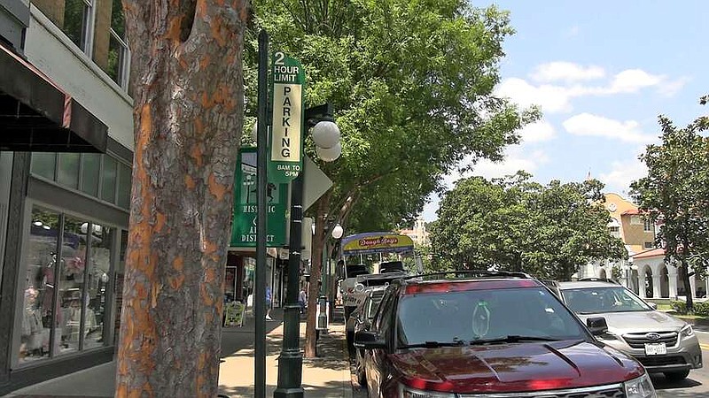 Vehicles park in free spots along upper Central Avenue Tuesday. The city expects to begin charging for the spots Oct. 1. (The Sentinel-Record/James Leigh)