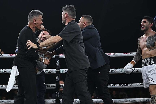 Boxer’s brother throws punch at rival’s trainer