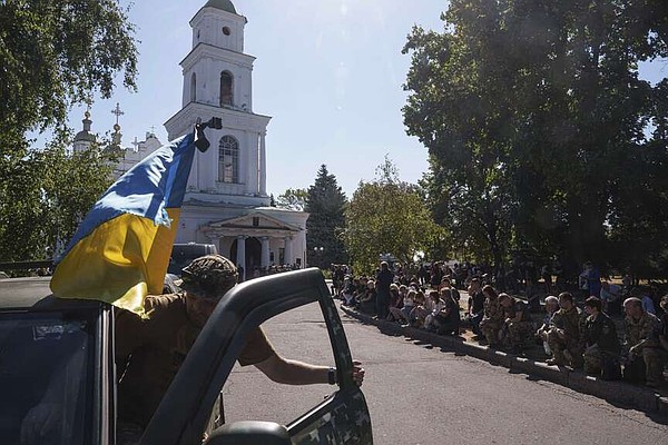 Ukrainians mourn after major Russian strike, vows intense response