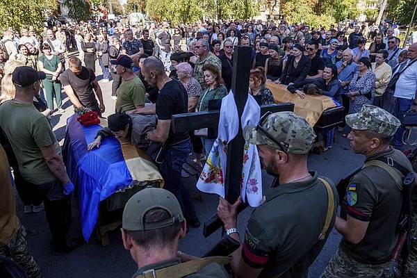 Ukrainians mourn at services for strike’s dead