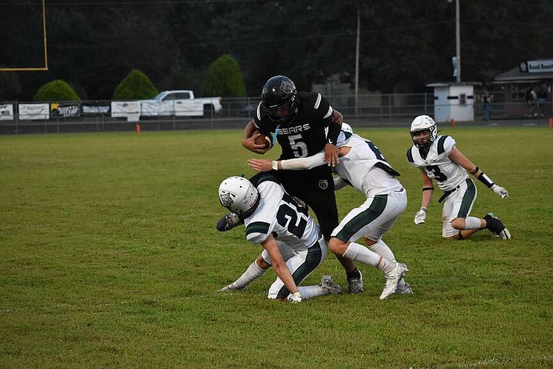 Photo by Britney Layne
Hard to bring down
Matthew Chambers (5) powers through Wildcat tacklers during Friday night's game in Bearden. The Bears dominated the Wildcats 43-0.