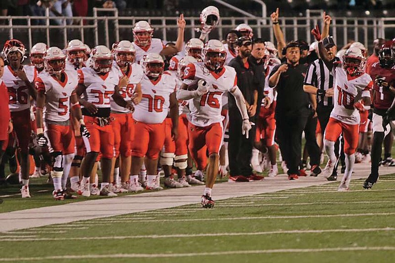 (Photo by Patric Flannigan)
On your Marks...
Senior defensive back Zakilian Marks intercepts a Pine Bluff Zebra pass and races it 90 yards for a touchdown to end the first half. The Cardinals handed the Zebras their second shutout of the season with a 27-0 victory.