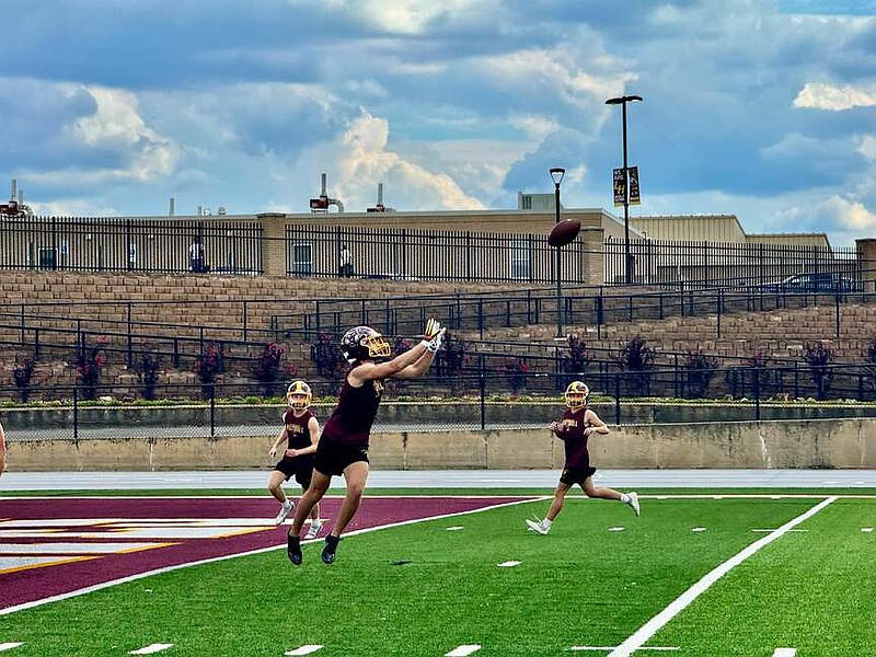 A Lake Hamilton defender makes an interception during football practice on Sept. 5 at Wolf Stadium. The Wolves travel to Siloam Springs today for Class 6A-West Conference action. (The Sentinel-Record/Bryan Rice)