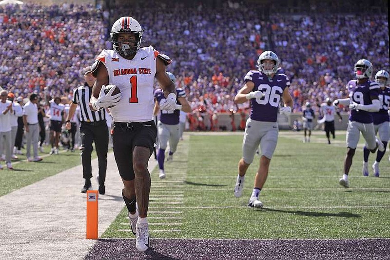 Johnson scores 5 touchdowns as ’Cats bounce back with rout The