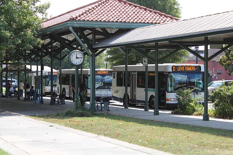 City buses are shown Saturday at Transportation Depot. The city plans to install new benches that will discourage sleeping at the Depot. (The Sentinel-Record/Braden Sarver)