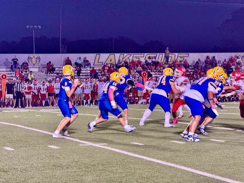 Lakeside junior quarterback Wally Wolcott sets to throw a pass over the middle in Friday night's match against the Magnolia Panthers at Chick Austin Stadium. (The Sentinel-Record/Bryan Rice)