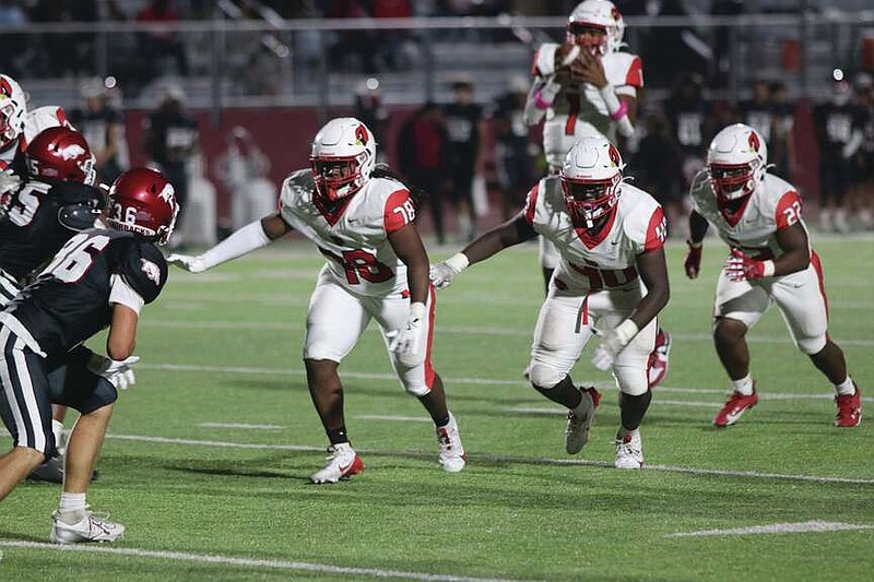 Three the hard way
Amarion Lindsey (78), Jy'Mauri Utsey (40) and Justin Frazier (22) look to block any Razorback defenders considering bringing pressure as quarterback Juney Atkins (1) collects the snap. The Cardinals blocked well on every level on its way to a 68-24 win against Arkansas High.