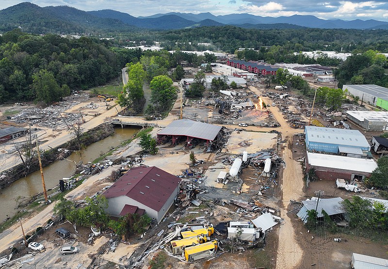 An aerial view of flood damage wrought by Hurricane Helene along the Swannanoa River on Oct. 3, 2024, in Asheville, North Carolina. At least 200 people were killed in six states in the wake of the powerful hurricane which made landfall as a Category 4. President Joe Biden took an aerial tour of the devastated region yesterday and ordered the deployment of 1,000 active duty U.S. soldiers to assist with storm relief efforts and reinforce the North Carolina National Guard. (Mario Tama/Getty Images/TNS)