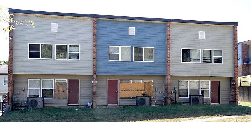 Boards were covering broken windows Wednesday at Mountain View Heights, the name given to what was the city's public housing stock prior to the 2018 RAD conversion. (The Sentinel-Record/Donald Cross)