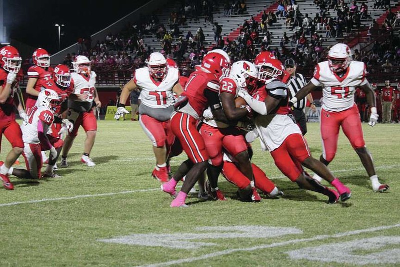 Photo via CFHS Yearbook
Pound goes Frazier
Justin Frazier (22) powers through Magnolia defenders as Taylor Davis (71) and Jordan McCoy (51) attempt to block down the field. The Cardinals pounded the ball and finished with over 400 rushing yards in the win.