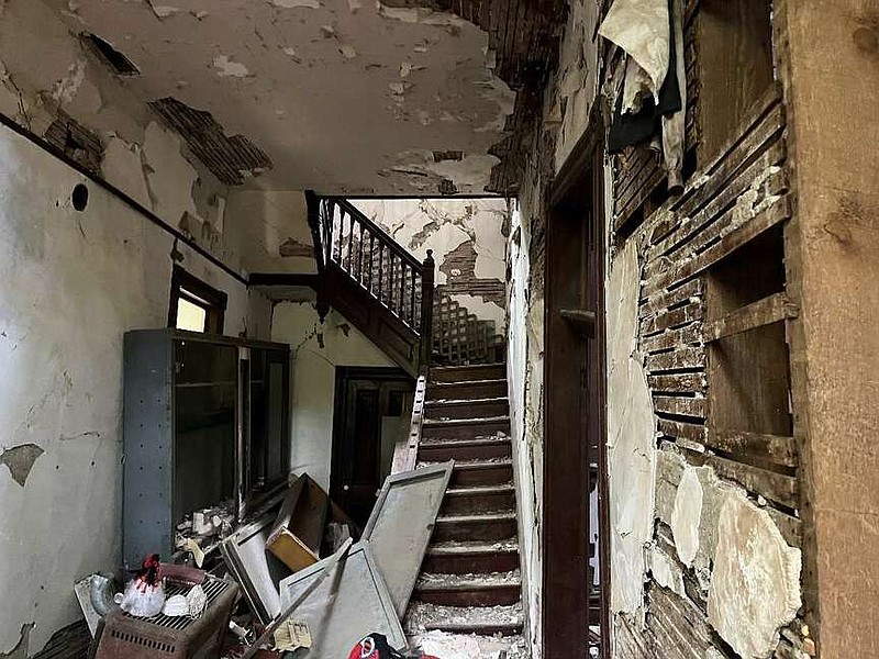 This photograph of the interior wall and stair failure inside Passmore House is included in Crafton Tull's residential structural observation and assessment report. (City of Hot Springs/Crafton Tull)