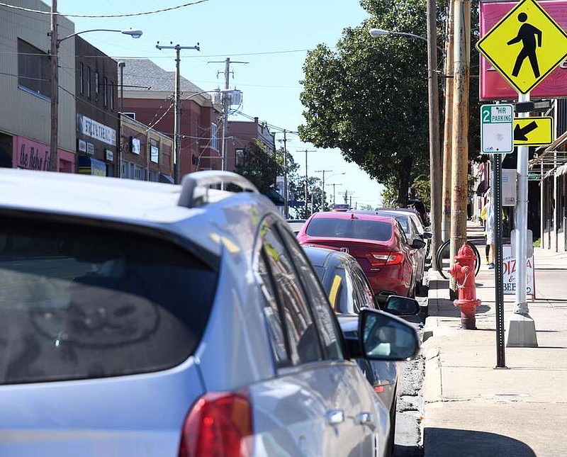 Cars park for free Wednesday on Ouachita Avenue. Parking rates the city adopted Tuesday will charge $2 an hour for the spaces. (The Sentinel-Record/Donald Cross)