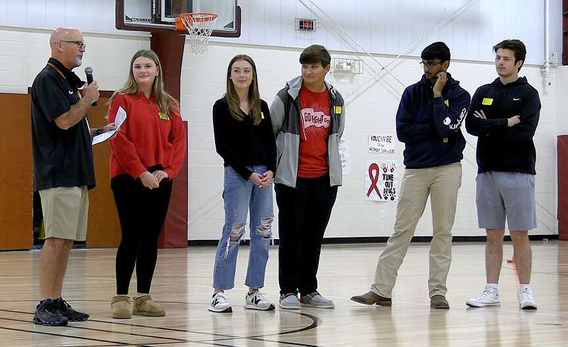 Coach Morry Sanders, left, speaks to students at Lake Hamilton Middle School's drug prevention rally on Tuesday. (The Sentinel-Record/Thomas Buckman)