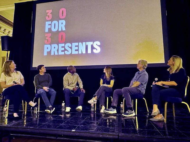 ESPN 30 for 30 15th anniversary panelists, from left, Carolyn Hepburn, Gentry Kirby, Marquis Daisy, Haley Watson, Steve James, and Variety freelance writer Addie Morfoot, who served as the moderator, look up at the screen during the Hot Springs Documentary Film Festival at the Arlington Resort Hotel & Spa on Monday. (The Sentinel-Record/Bryan Rice)