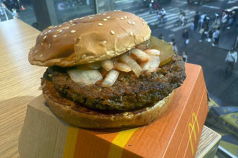 A McDonald's Quarter Pounder hamburger is shown in this photograph, in New York's Times Square, Wednesday, Oct. 23, 2024. (AP Photo/Richard Drew)