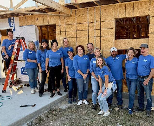 Agents from Trademark Real Estate recently held a Team Build Day with Garland County Habitat for Humanity. (Submitted photo)