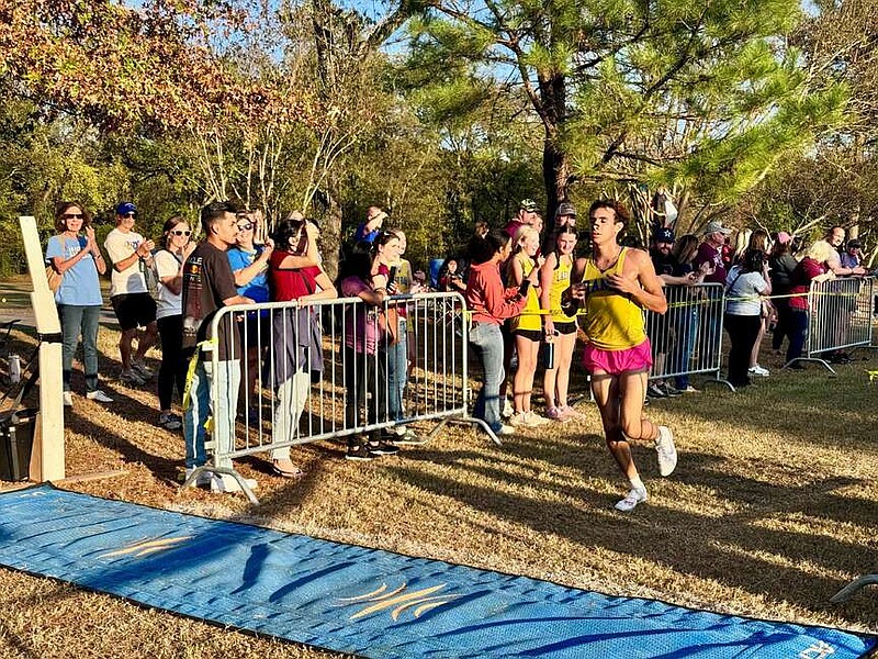 The Lakeside Rams' Diego Martinez crosses the finish line Tuesday to take first place in the 5A South boys conference championship meet at Essex Golf Club. (The Sentinel-Record/Bryan Rice)