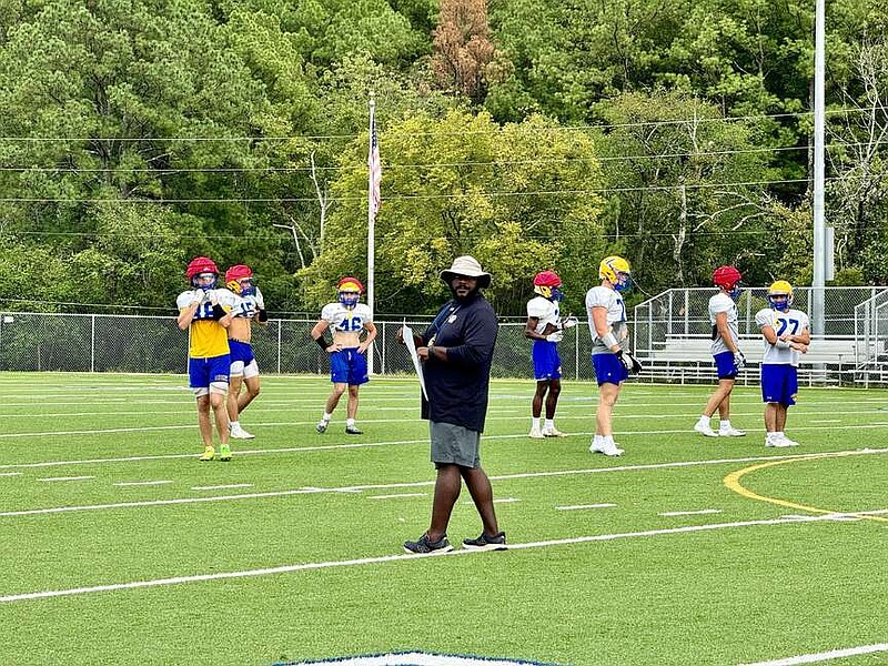 Lakeside Rams head football coach Darren Rockwell, center, walks on the field during a practice last month. (The Sentinel-Record/Bryan Rice)