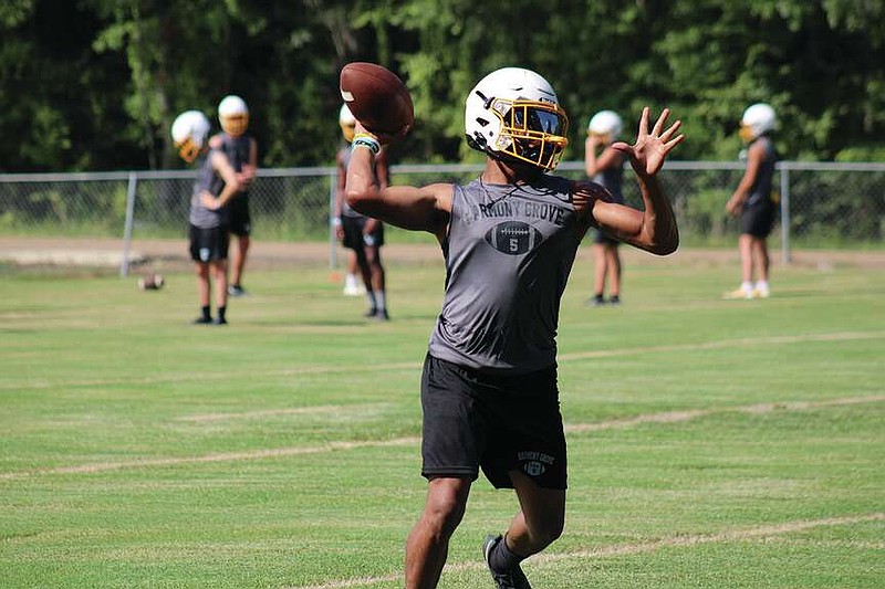 Do It All Damien
Harmony Grove quarterback Damien Burns warms up before a Fall practice earlier this year. Burns was responsible for 7 touchdowns against Centerpoint last week.