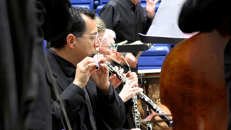 Members of the Arkansas Symphony Orchestra perform at Bank OZK Aren on Wednesday. The performance was part of “Dance Around the World,” ASO's 19th Children's Concert in Hot Springs. (The Sentinel-Record/Thomas Buckman)