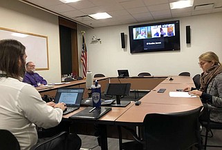 In this 2024 file photo members of the Fayetteville City Council's Ordinance Review Committee and city staff meet in person and online at City Hall.
(NWA Democrat-Gazette/Stacy Ryburn)