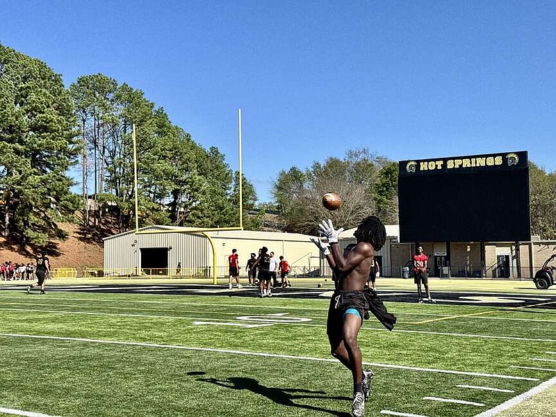 Hot Springs Trojans wide receiver T.J. Ellis catches a pass in practice on Wednesday. Troy travels to Lakeside for the Battle for Bathhouse Row tonight. (The Sentinel-Record/Bryan Rice)