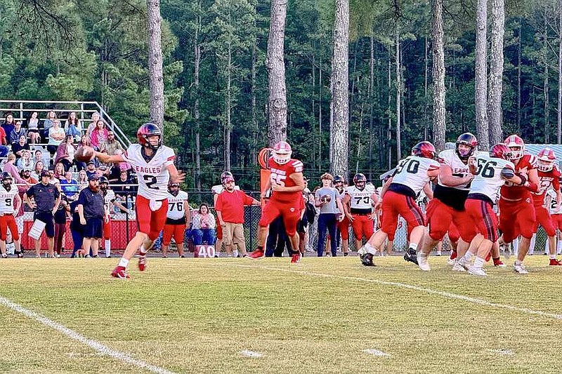 Cutter Morning Star senior quarterback Peyton Mills (2) prepares to throw on the run during a game earlier this season at Mountain Pine. (The Sentinel-Record/Bryan Rice)