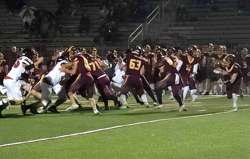 The Lake Hamilton Wolves hosted the Russellville Cyclones Friday night at Wolf Stadium and dominated the Cyclones, 56-24, to end the season despite soaking wet conditions. (The Sentinel-Record/Donald Cross)