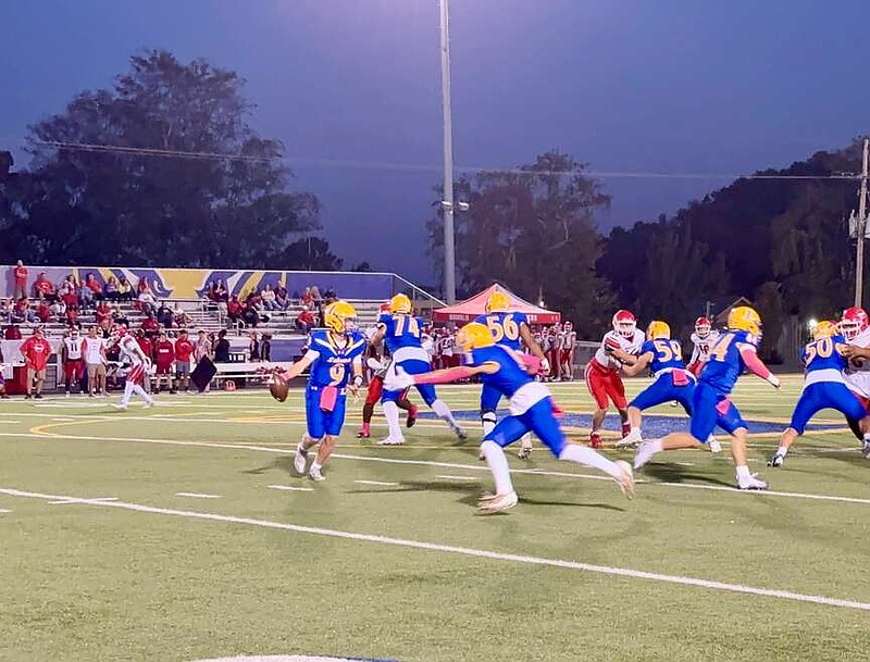 Lakeside junior quarterback Wally Wolcott fakes a handoff to senior Ben Vincent in the Rams' 36-7 victory over Magnolia on Oct. 4 at Chick Austin Stadium. (The Sentinel-Record/Bryan Rice)