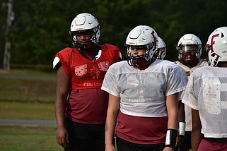 Fordyce freshman quarterback Andreal Ellison Jr. and sophomore offensive lineman Bryant Robinson look for a play call during practice Wednesday, Nov. 13, 2024. (Pine Bluff Commercial/I.C. Murrell)