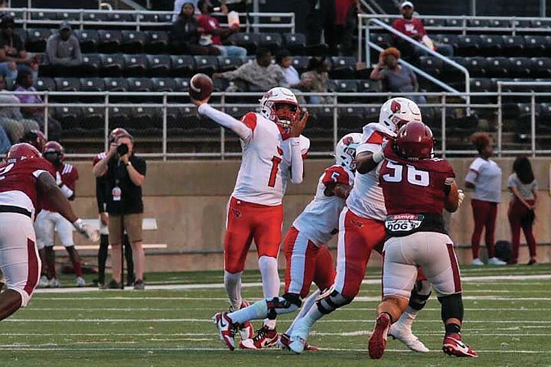 Photo by Patric Flannigan
Camden Fairview senior quarterback Darre'll "Juney" Atkins Jr. throws a quick pass during a game against Pine Bluff at the UAPB Golden Lion Stadium in September. The Cardinals will play on its second college football field of the season on Friday will they travel to play Harding Academy at Harding University.