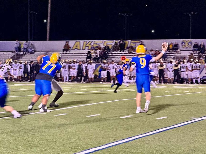 Lakeside junior quarterback Wally Wolcott (9) throws a pass to Drew Morgan (84) in the first round of the Class 5A state playoffs Friday night at Chick Austin Stadium. (The Sentinel-Record/Bryan Rice)