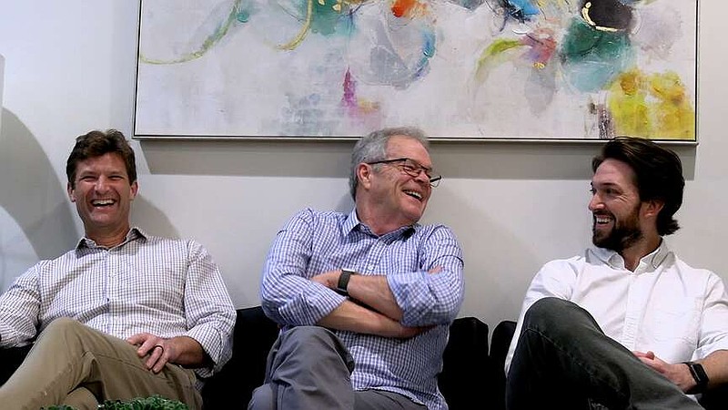 From left, Drs. Lance Porter, Jack Porter, and Will Warren reflect on Porter Dental Clinic's 50 years of operation. The clinic celebrated its anniversary with an open house last month. (The Sentinel-Record/Thomas Buckman)