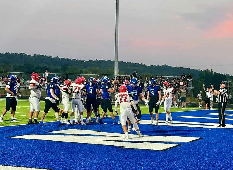 Jessieville's Daniel Dellis (15) tosses the ball to a referee in the end zone after scoring earlier this season. (The Sentinel-Record/Bryan Rice)