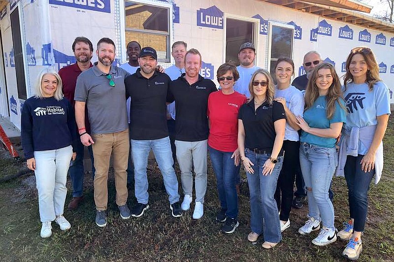 WinChoice employees are shown at a Garland County Habitat for Humanity job site. (Courtesy Garland County Habitat for Humanity)